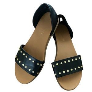 Andiamo Black faux leather bohemian slip on sandals with studs.